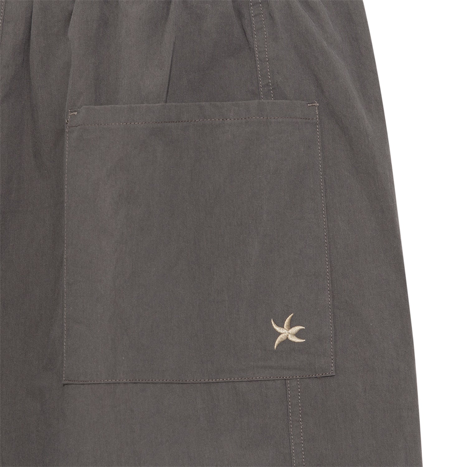 TCM mini logo nylon pants