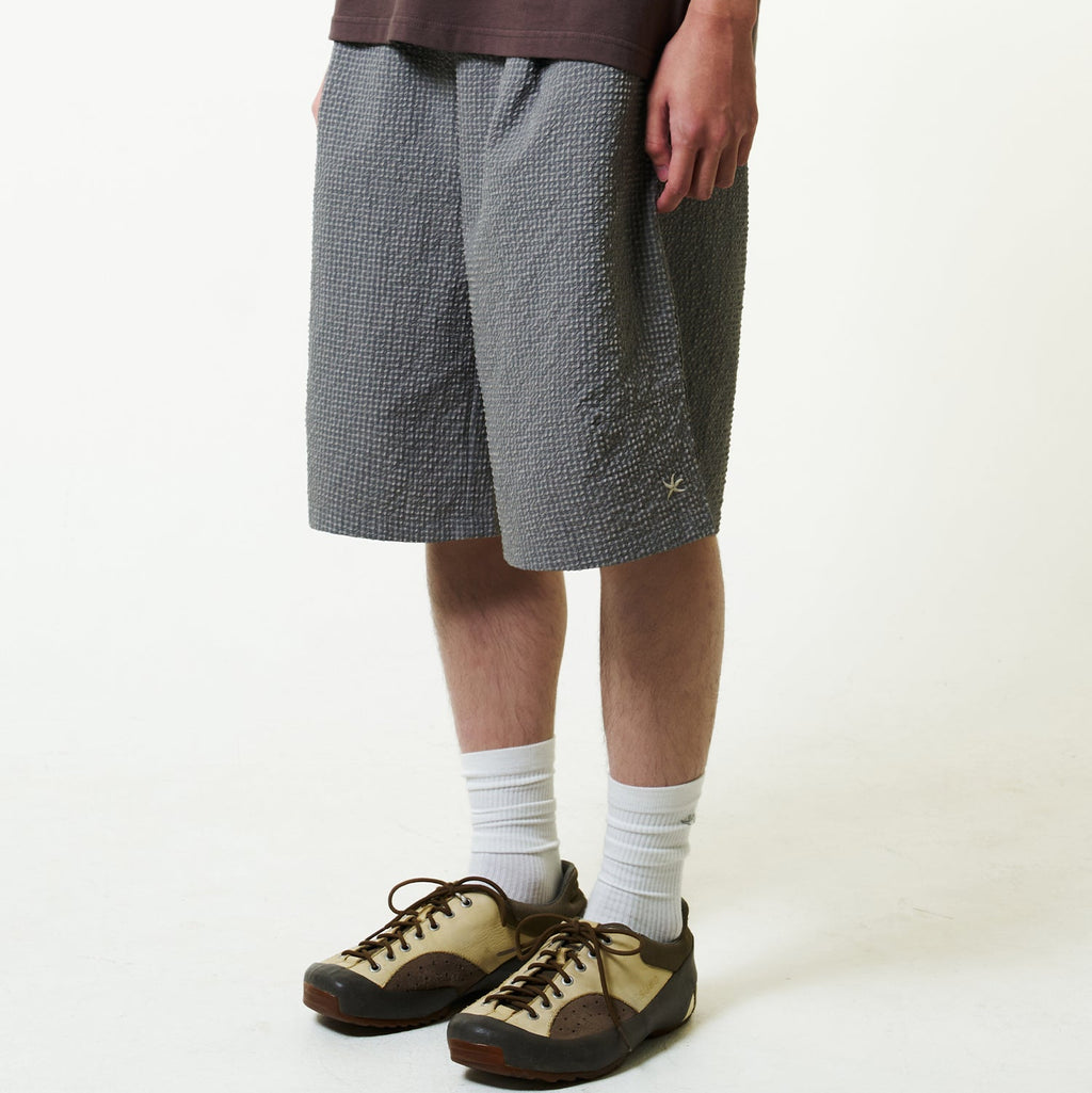 TCM mini logo relaxed half pants